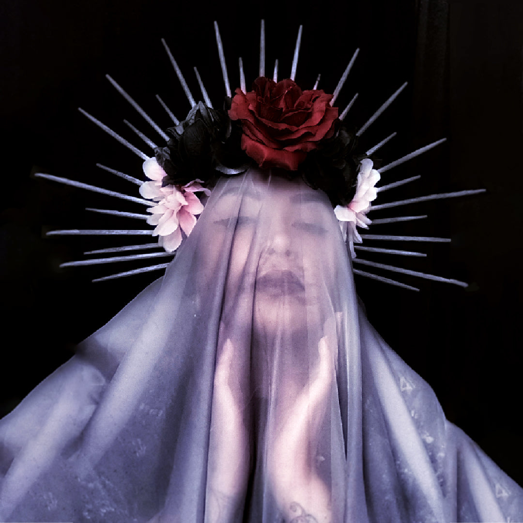 Woman With a Flower Crown and Veil, touching her face